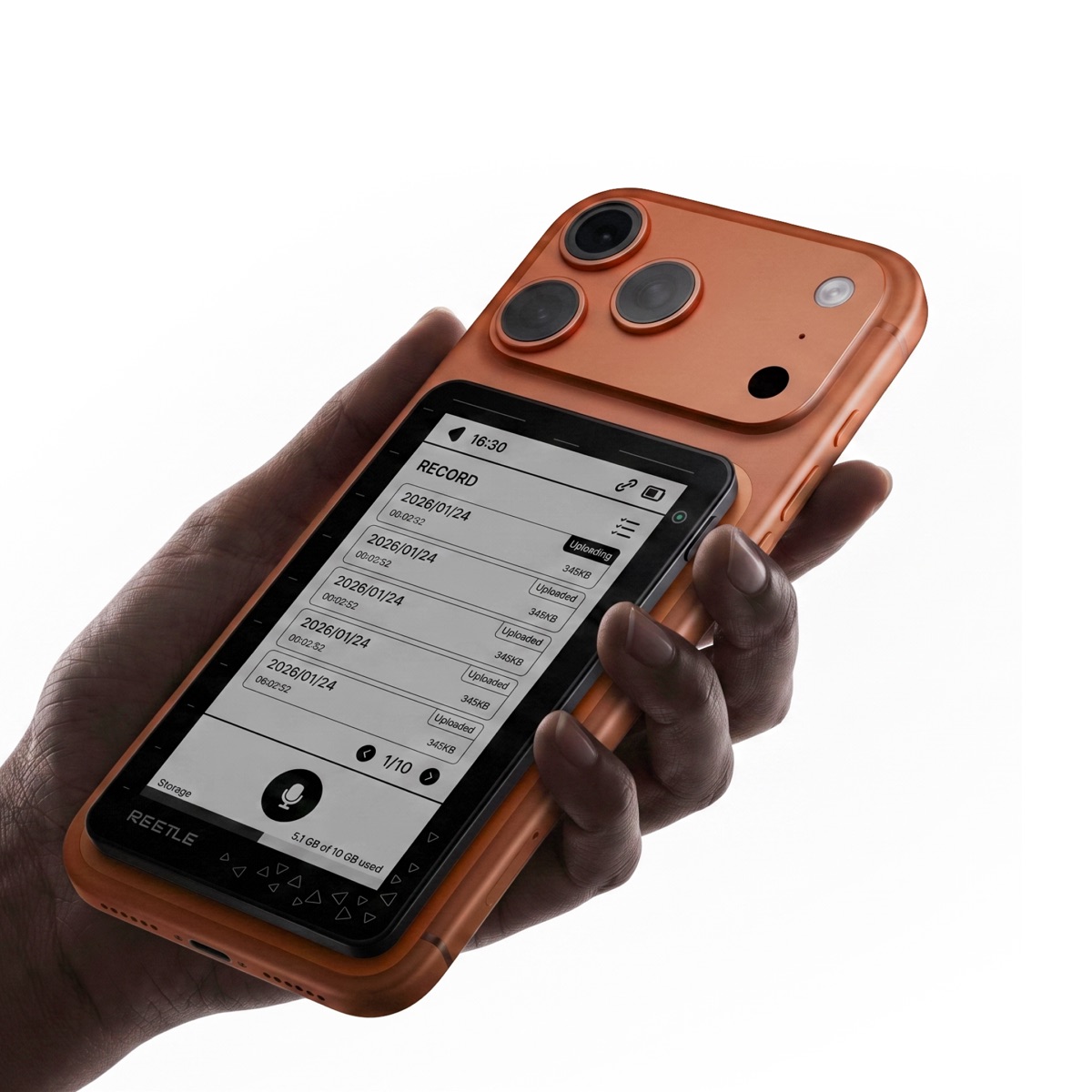 A hand holding the Reetle hub in Sunset Orange, the display showing a list of uploaded lecture recordings.